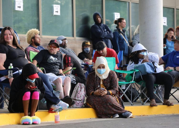 People Wait In Line To File For Unemployment Benefits In Frankfort, Kentucky