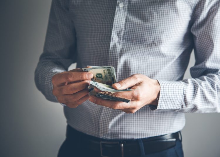 young business man hand money