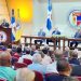En el pódium Julio Cross Frías. Le acompañan Frank Moya Pons, Magín Díaz e Isidoro Santana. - Fuente externa.
