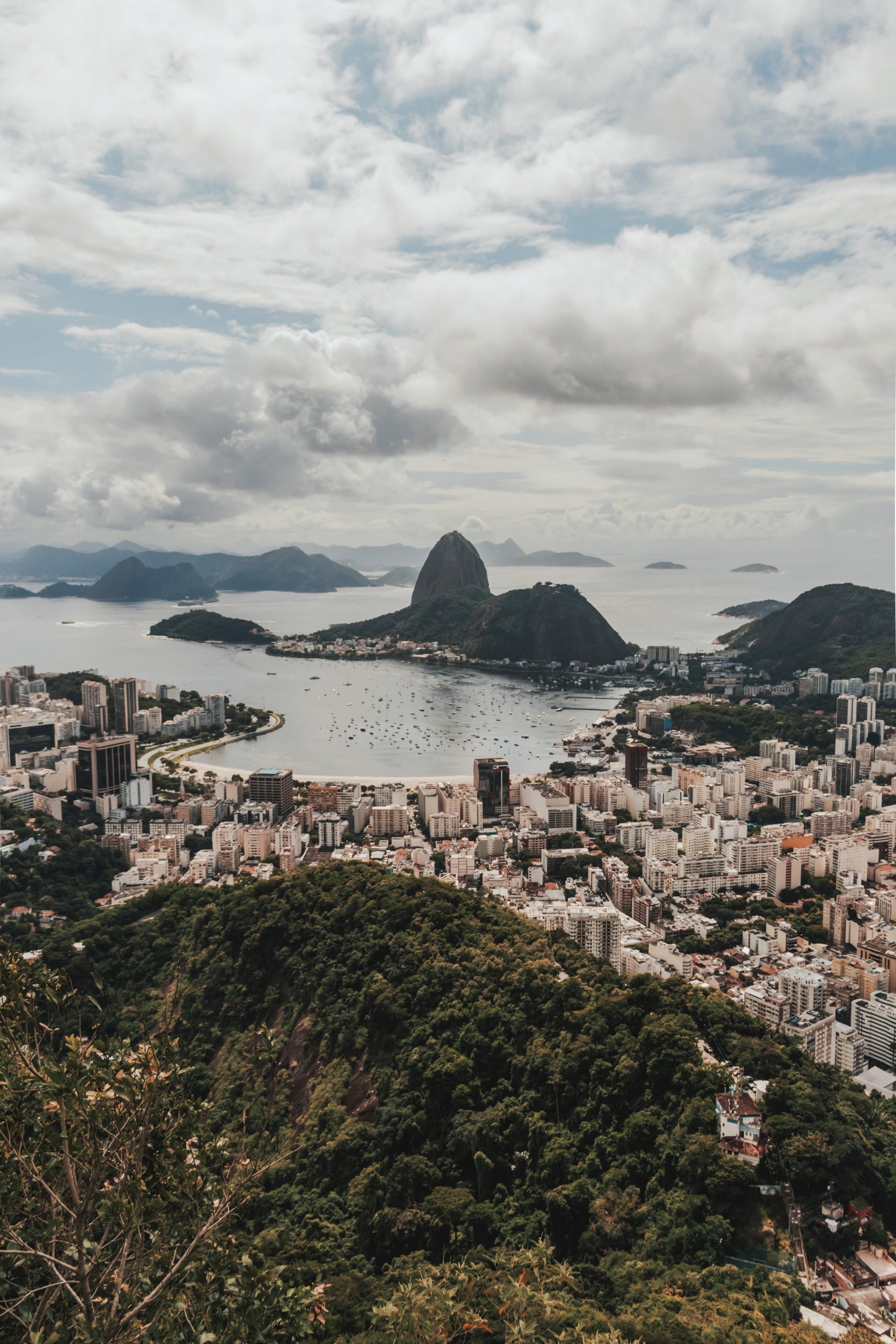 city near body of water under cloudy sky 3648269