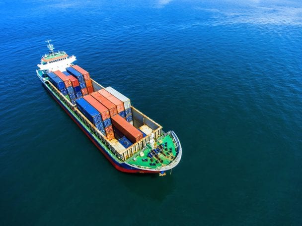 container ship in import export and business logistic.by crane ,